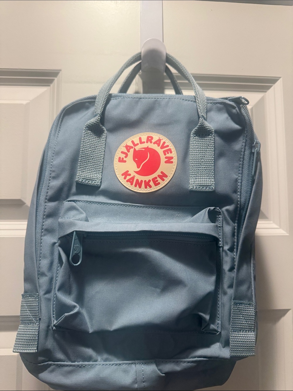 Kipling Mini Backpack in Light Blue with Red Logo